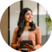 portrait-pretty-smiley-asian-woman-standing-working-space-holding-tablet-looking-modified